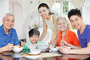 Portrait Of Multi-Generation Chinese Family Eating