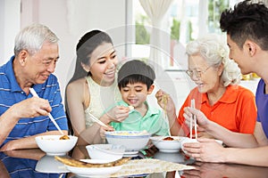 Portrait Of Multi-Generation Chinese Family Eating