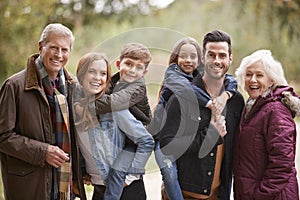 Portrait Of Multi Generation Family On Autumn Walk In Countryside Together