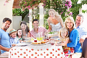 Portrait Of Multi Generation Family Meal photo