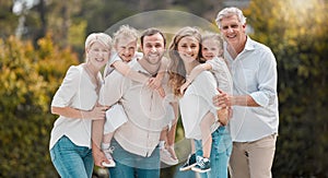 Portrait of multi-generation family standing together. Extended caucasian family smiling while spending time together at