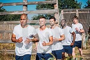 portrait of multicultural young soldiers running