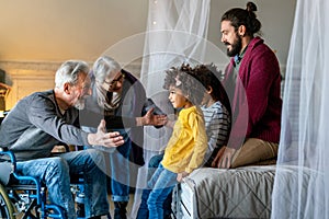 Portrait of multiethnic happy multigeneration family with adopted child. Love people concept