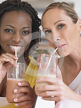 Portrait Of Multiethnic Women Drinking Milkshake