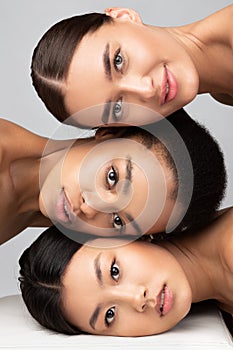 Portrait Of Multiethnic Women Looking At Camera, Gray Background, Vertical