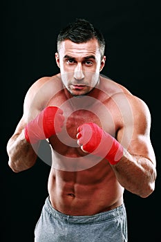 Portrait of muscular male boxer in stance