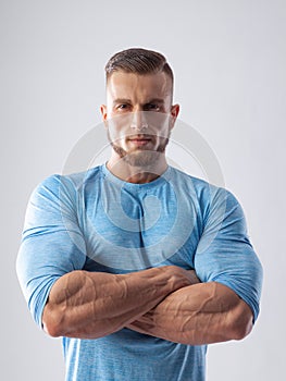 Portrait of a muscular male model on white background