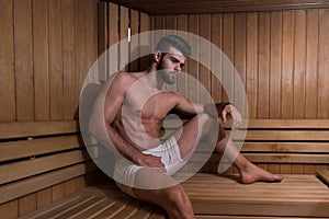 Portrait Of A Muscular Man Relaxing In Sauna