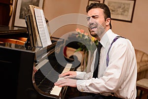 Portrait of music performer playing his piano