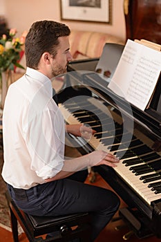 Portrait of music performer playing piano