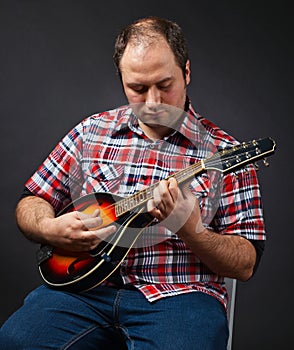 Portrait of musician with mandolin