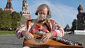 Portrait of a musician with music instrument gusli