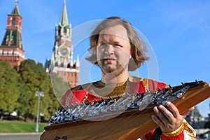 Portrait of a musician with old Russian music instrument gusli