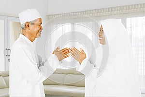 Muslim grandparents forgiving each other photo