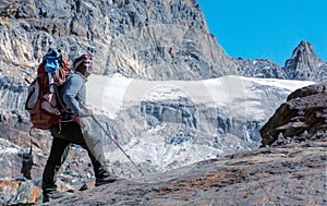 Portrait of Nepalese Mountain Guide staying on Glacier toned