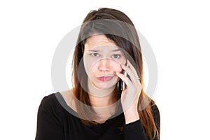 Portrait of nervous worry girl holding smartphone in hands having bad news isolated on white background