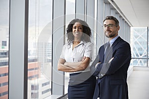 Portrait Of New Business Owners In Empty Office photo