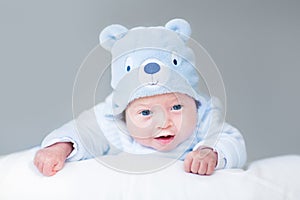 Portrait of newborn baby boy in teddy bear hat