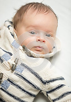 Portrait of newborn baby boy in wool sweater