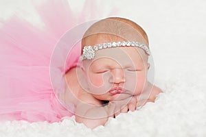 Portrait of a Newborn Baby Girl in Pink Tutu