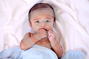 Portrait of newborn baby teething and suck reflex