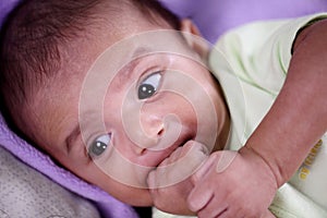 Portrait of newborn baby teething and suck reflex photo