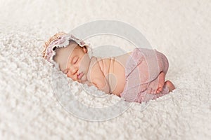 Portrait of a Newborn Girl with Lace Pants and Bonnet