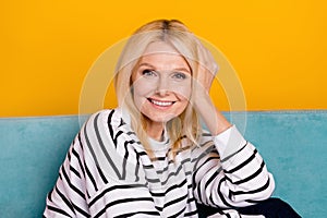 Portrait of nice adorable pensioner lady sitting divan live stream in online blog isolated vibrant color background