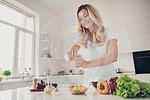 Portrait of nice attractive cheerful wavy-haired lady making healthy weightloss vitamin tasty yummy delicious dinner