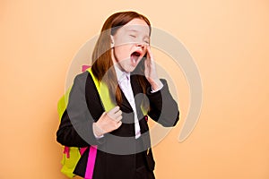 Portrait of nice attractive lovely tired bored hard-working pre-teen girl learner wearing jacket blazer boredom class