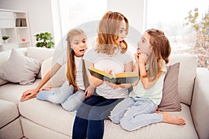 Portrait of nice cute amazed shocked lovely attractive charming cheerful cheery redhair people mom mommy mum reading