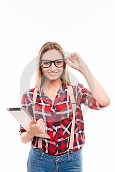 Portrait of nice hipster girl on white background with tablet