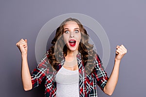 Portrait of nice-looking attractive charming glad cheerful wavy-haired lady opened mouth fan winner isolated over gray