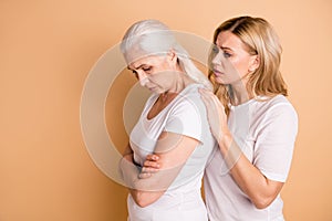 Portrait of nice-looking attractive gloomy grumpy moody bored tired ladies wearing white outfit supporting granny