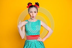 Portrait of nice pretty cute amazed wondered girl wearing dotted dress pouted lips isolated over vibrant yellow color