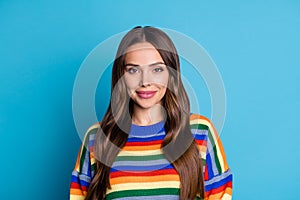 Portrait of nice stunning friendly girl look in camera wear shine pullover isolated over blue color background
