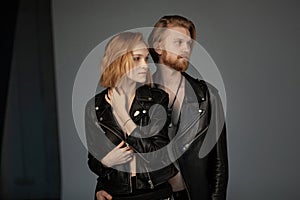 Portrait of nice sweet lovable cheerful people in black leather jackets
