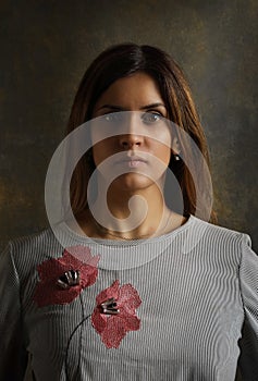 Portrait of a nice young brunette woman in the studio