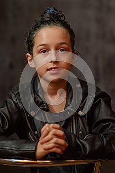 Portrait of nine year old girl. Teenager with blue strands on her hair. A series of photos of a girl of 8 or 9 years old