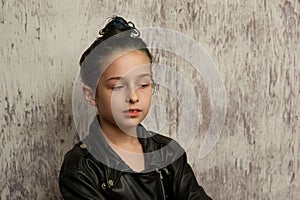 Portrait of nine year old girl. Teenager with blue strands on her hair. A series of photos of a girl of 8 or 9 years old