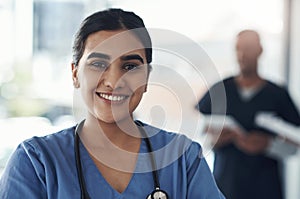 Portrait, nurse and happy woman in hospital for healthcare career, wellness and service in Brazil. Face, smile and young