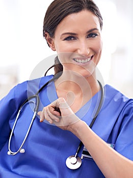 Portrait, nurse and happy woman in hospital for healthcare, wellness or working on career in Spain. Face, medical