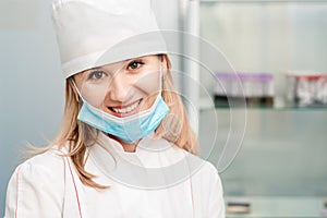 Portrait of nurse with lowered mask