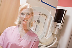 Portrait Of A Nurse With Mammogram Machine