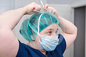 Portrait of nurse with mask in surgery room