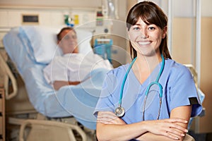 Portrait Of Nurse With Patient In Background photo