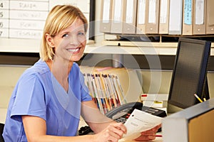 Portrait Of Nurse Working At Nurses Station