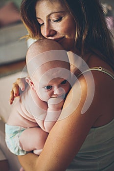 Portrait o middle age mother with her baby.