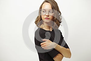 Portrait of an offended or envious woman proudly wraps head back over shoulder on white isolated background. Girl with