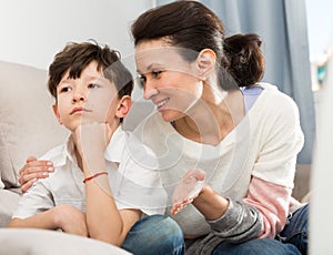 Mom soothing offended tweenager photo